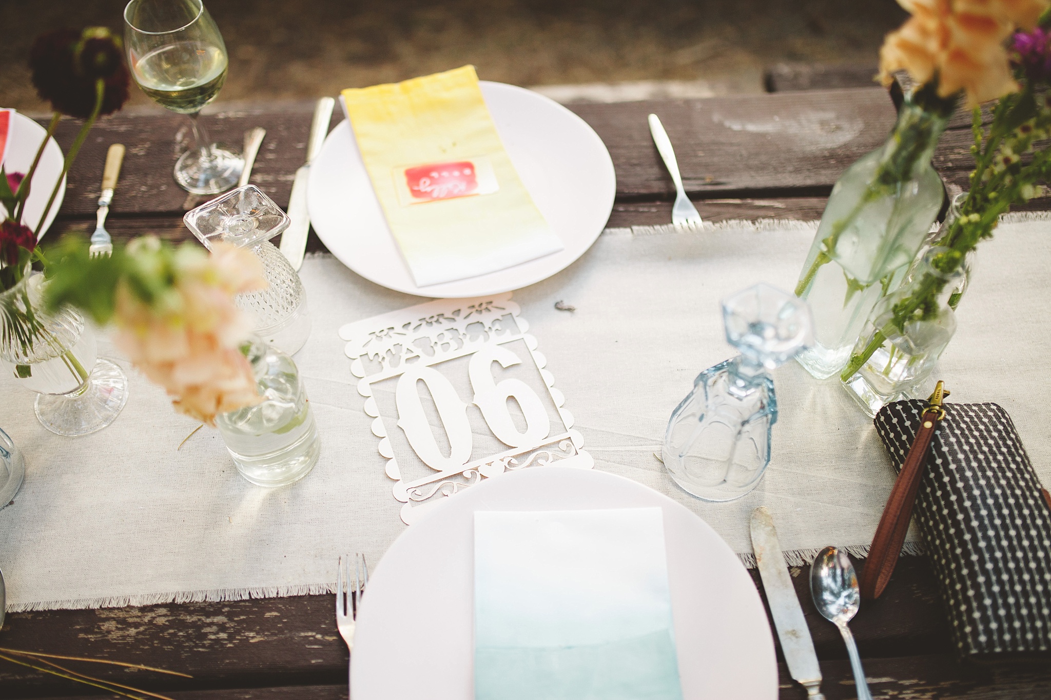 colorful place settings for woods wedding